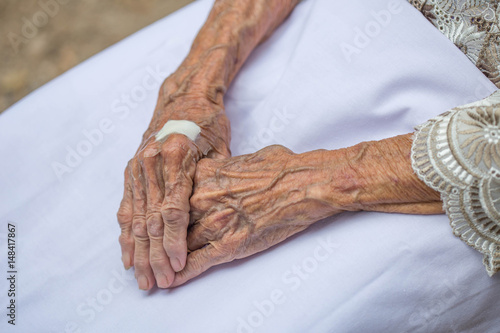 Hands of the old woman.