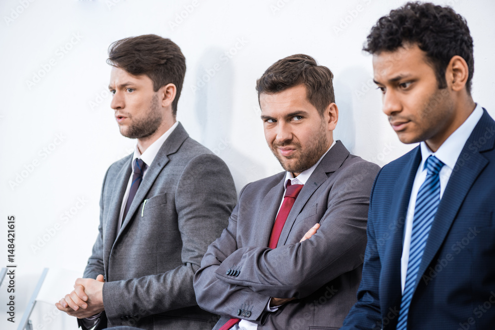 businessmen sitting in queue and waiting for interview in office, business concept businessmen sitting in queue and waiting for interview in office, business concept