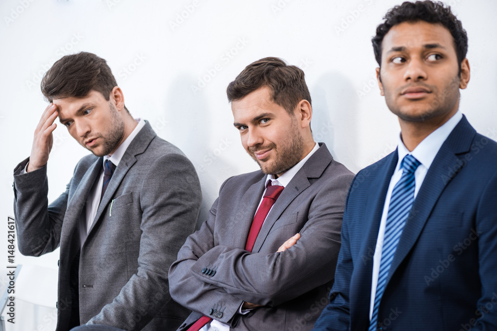 businessmen sitting in queue and waiting for interview in office, business concept businessmen sitting in queue and waiting for interview in office, business concept