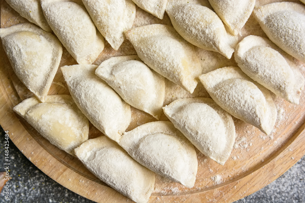 Cooking traditional Russian dumplings vareniki Cooking traditional Russian dumplings vareniki