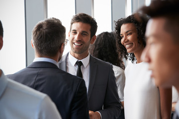 Group Of Businesspeople Having Informal Office Meeting