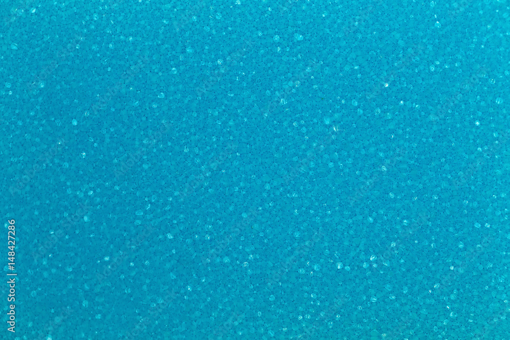 Macro sponge texture, blue bubbles.