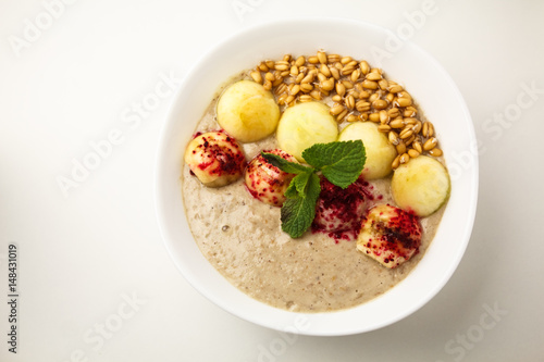 Porridge with apples and sprouted wheat. Theme of raw food, live food, healthy eating background