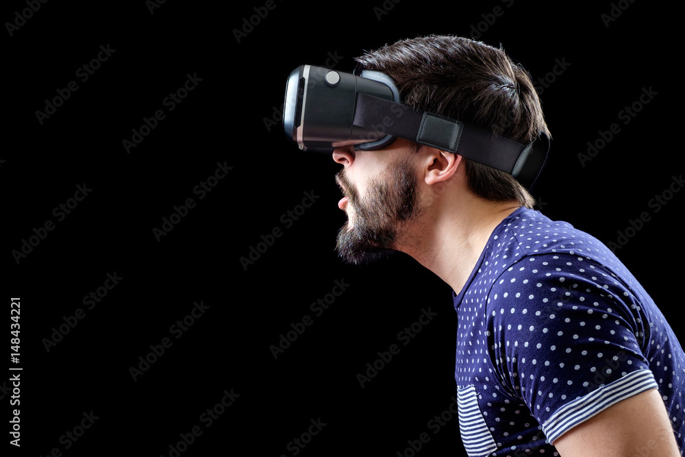 Young happy man experiencing virtual reality Young happy man experiencing virtual reality