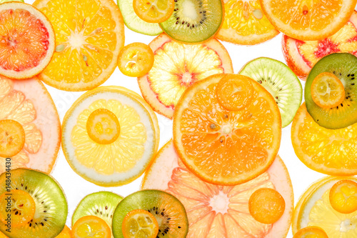 Mix of fresh transparent citrus fruits on white