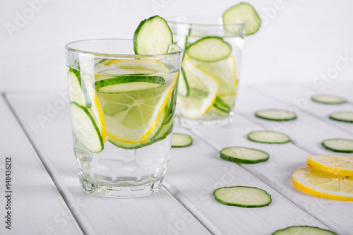 Refreshing cucumber cocktail, lemonade, detox water in a glasses on a white background. Summer drink. 