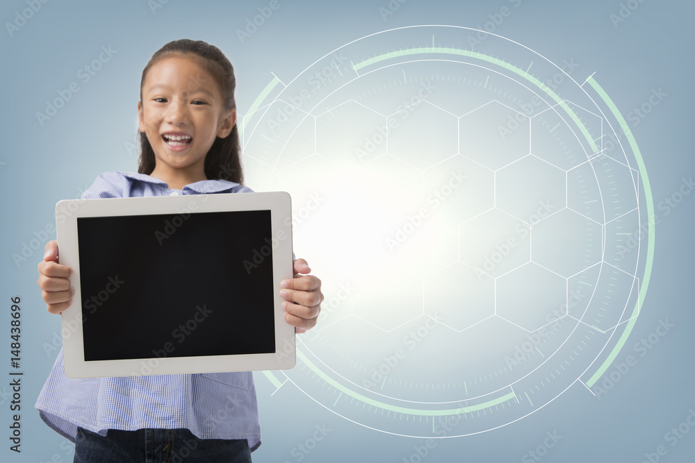 Little asian girl smiling and showing computer tablet screen with internet technology background, Concept of communication and online internet learning Little asian girl smiling and showing computer tablet screen with internet technology background, Concept of communication and online internet learning