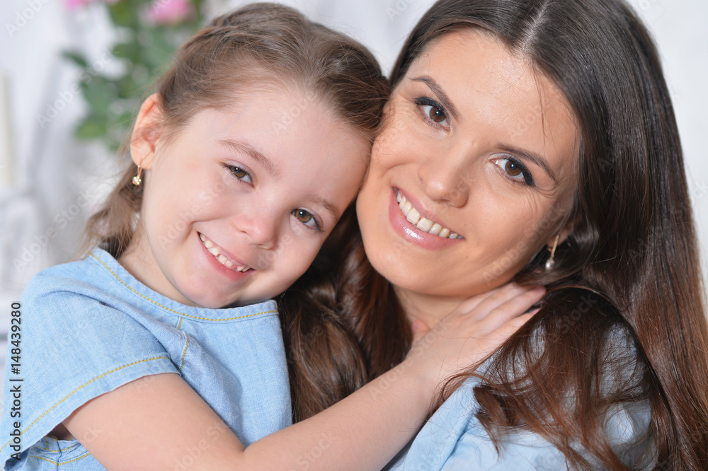 Little daughter with her mother Little daughter with her mother