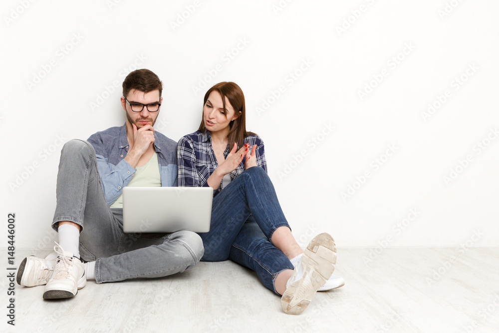 Thinking out of box. Casual couple using laptop Thinking out of box. Casual couple using laptop