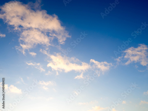 Blue bright sky with white clouds on sunny day. The vast blue sky and clouds sky.Beautiful background. Beautiful blue sky before sunset.