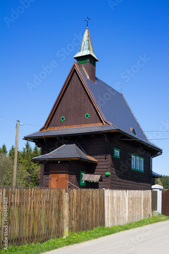 Church of Saint Cyril and Methodius, Hrcava, Czech Republic / Czechia - sacral building made of wooden logs. Rustic architecture photo