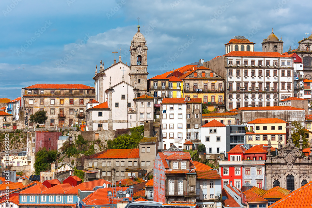 Aerial view with traditional multicolored quaint houses in Old town of Porto in the sunny day, Portugal