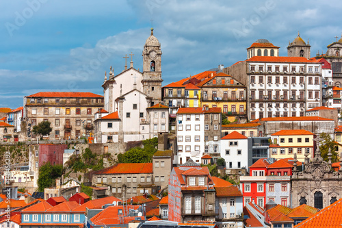 Aerial view with traditional multicolored quaint houses in Old town of Porto in the sunny day, Portugal