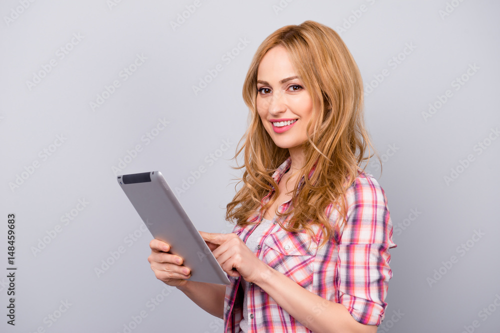 Pretty stylish young woman chatting on the tablet Pretty stylish young woman chatting on the tablet