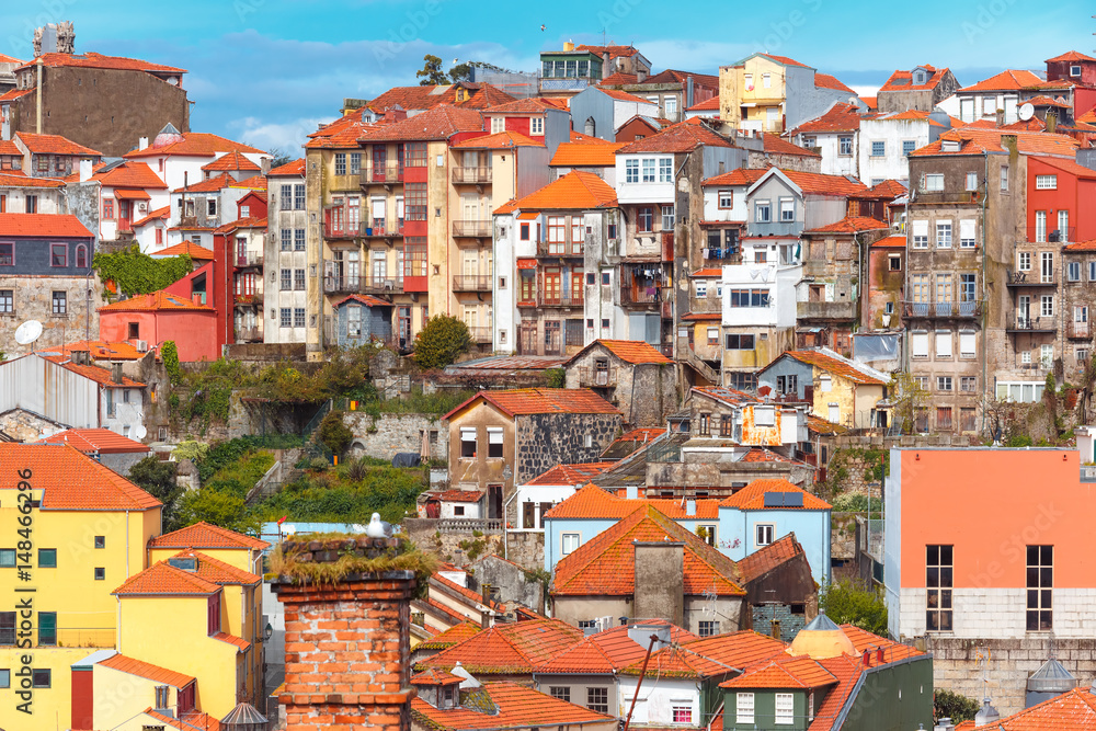 Aerial view with traditional multicolored quaint houses in Old town of Porto in the sunny day, Portugal