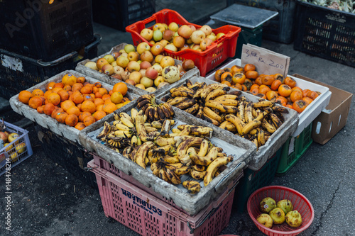 Bananas, oranges and apple for sell at morning market in George Town. Penang, 