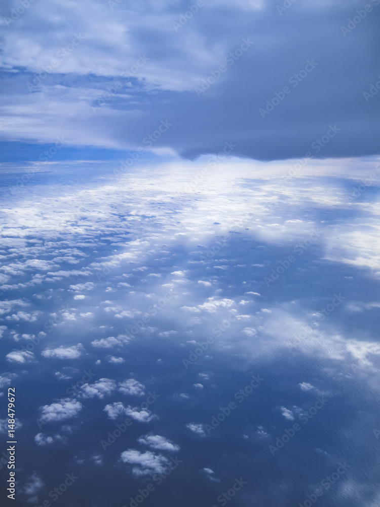 View of sea and clouds shot from a plane.