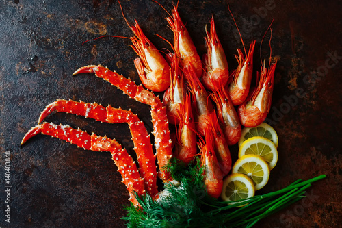 Shrimp and crab claws on a dark background