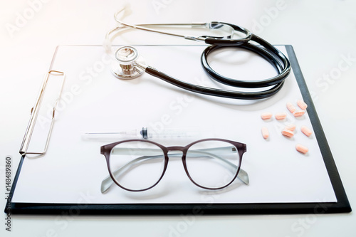 View of stethoscope and equipment on foreground table