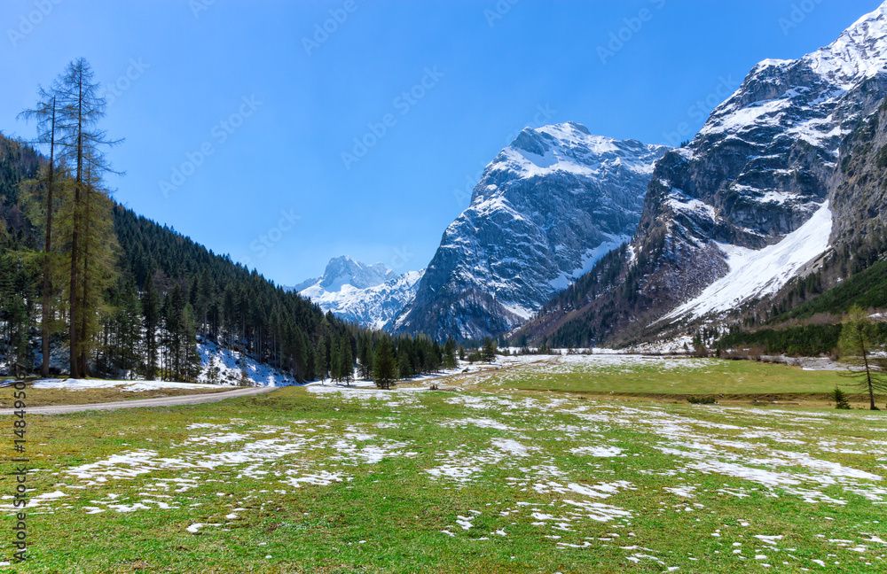 Fototapeta premium Spring mountain landscape with patches of melting snow. Austria, Tyrol, Karwendel Alpine Park