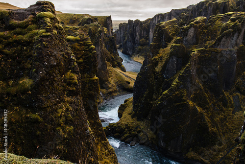 River running in between huge rocks, Fjadrargljufur Canyon in Iceland