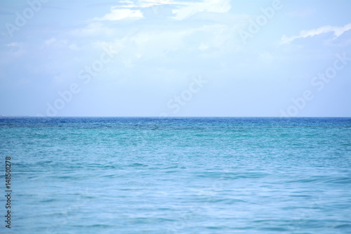 Horizon separating sea and blue sky