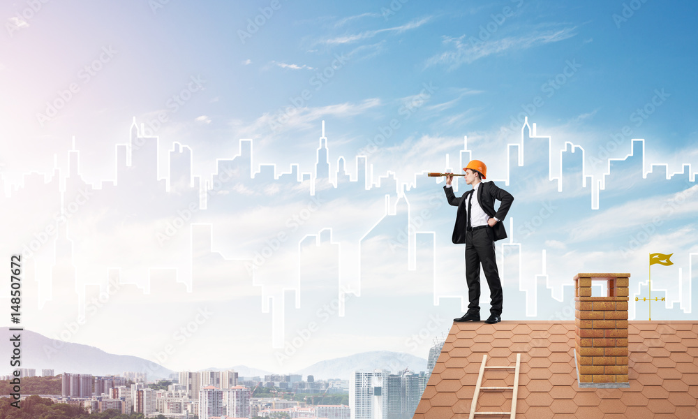 Engineer man standing on roof and looking in spyglass. Mixed media Engineer man standing on roof and looking in spyglass. Mixed media