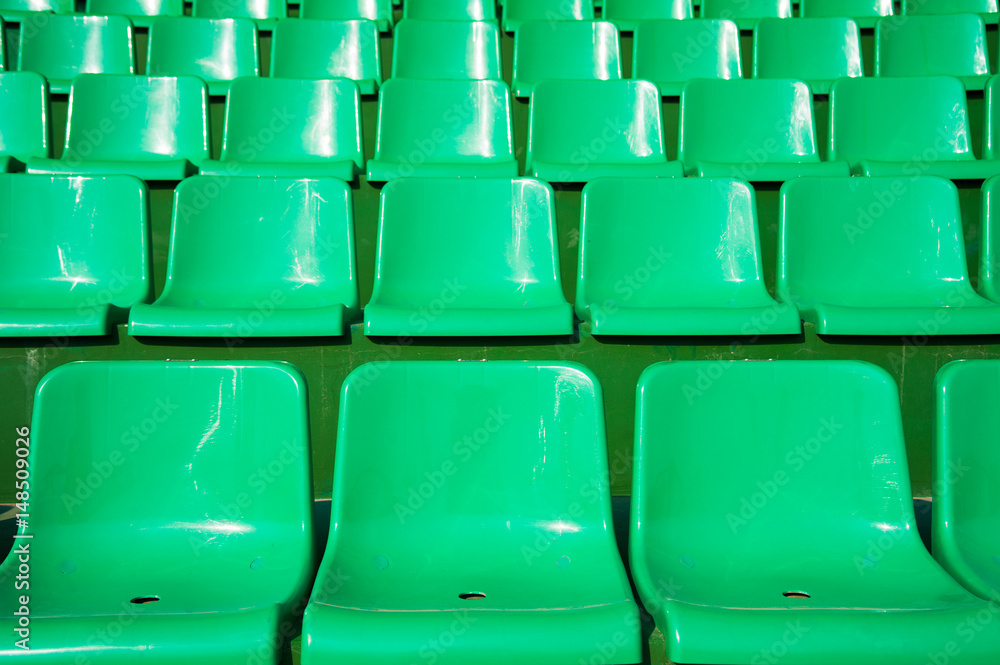 Empty green seats in stadium Empty green seats in stadium