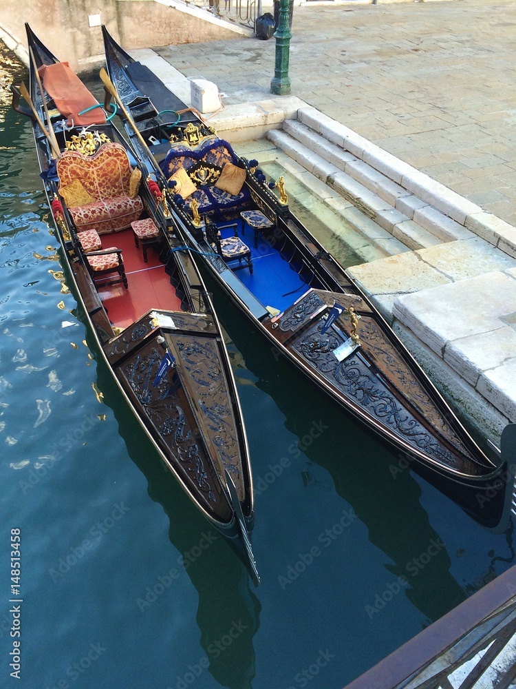 Colored boats in Venice city on water