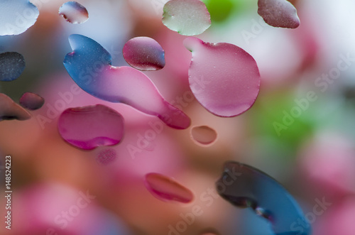 Colored water droplets on glass