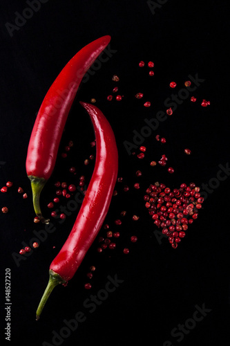 Red chili pepper on a black background