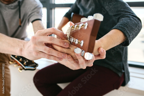 Learning to play the guitar. Music education and extra-curricular lessons.