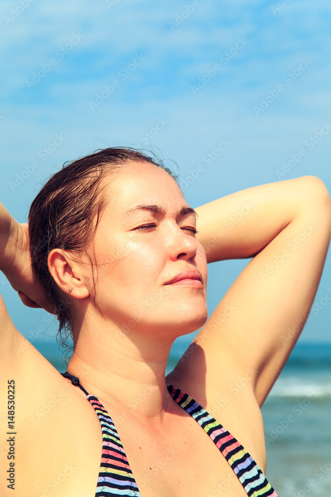 Beautiful young woman on a tropical beach. Beautiful young woman on a tropical beach.