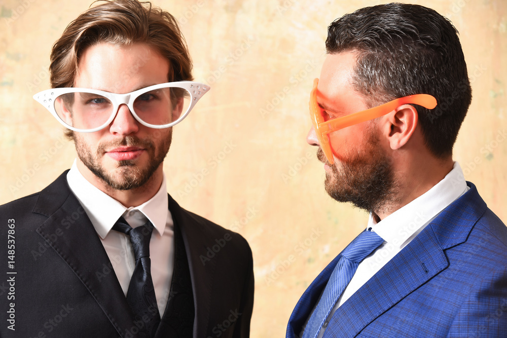 happy and serious bearded men with funny summer eyeglasses happy and serious bearded men with funny summer eyeglasses