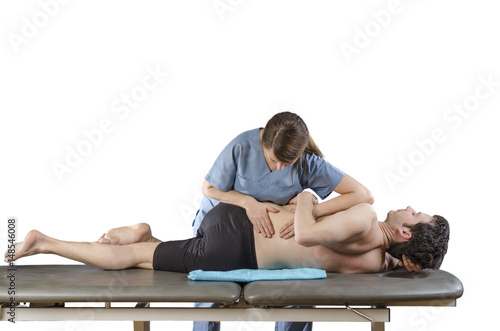 Physiotherapist doing manipulation to man patient. Osteopathy.