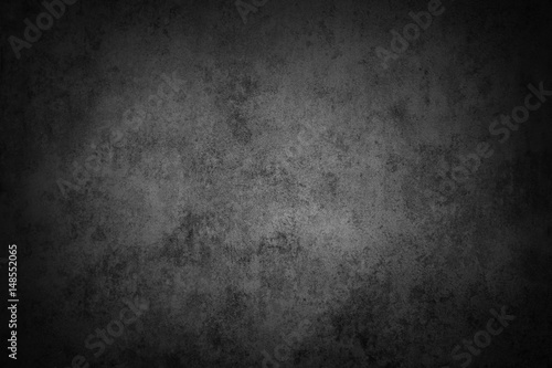 Grey textured stone wall background. Dark edges