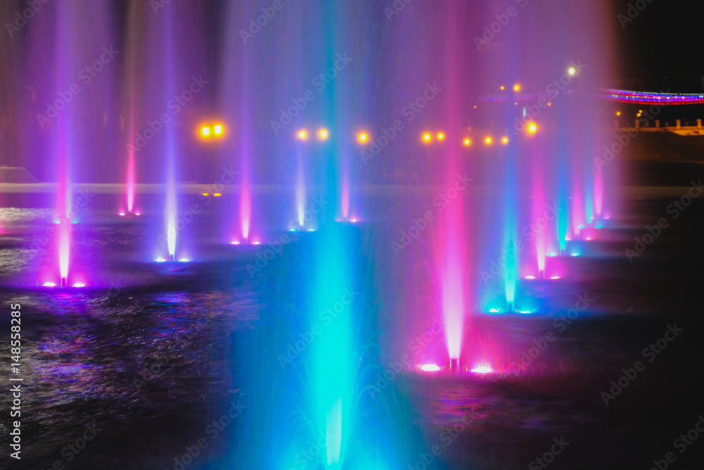 colored water fountain at night colored water fountain at night