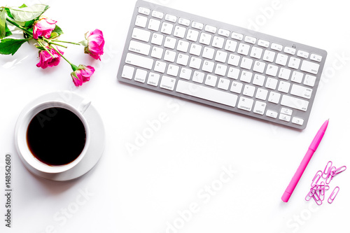 woman office desktop with coffee, flowers and keyboard white background top view mock-up