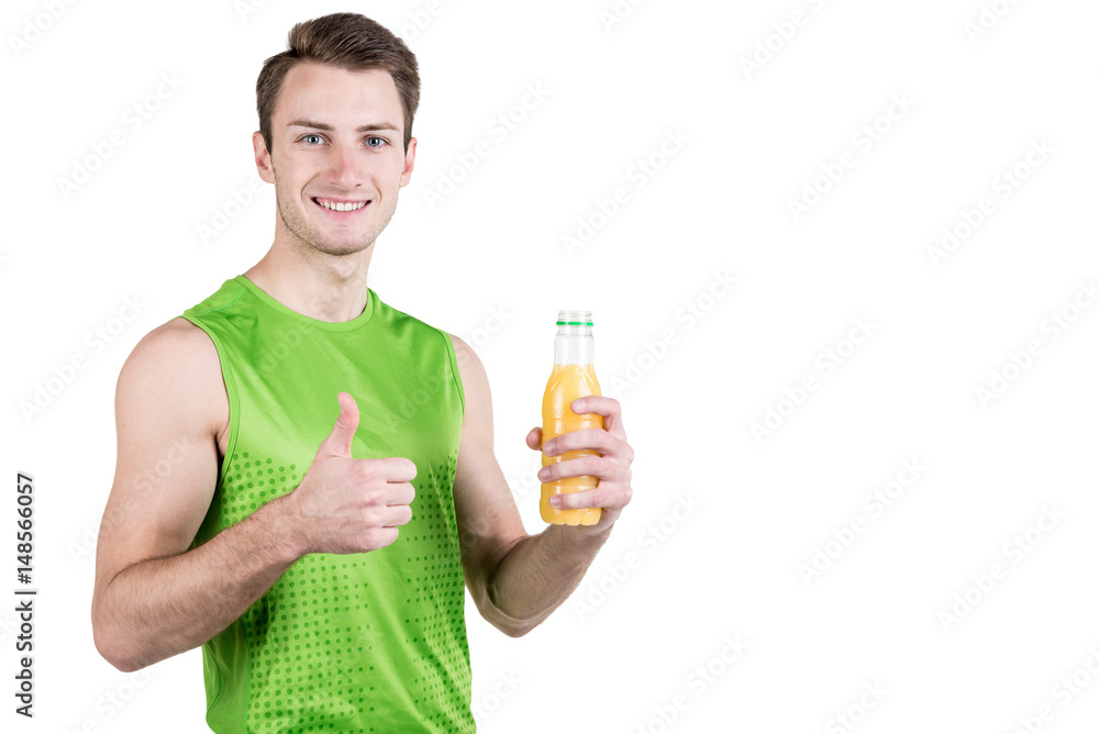 Healthy lifestyle. Portrait of a handsome guy with juice and a thumb up, in sportswear, isolated on a white background, looking at the camera. Horizontal frame Healthy lifestyle. Portrait of a handsome guy with juice and a thumb up, in sportswear, isolated on a white background, looking at the camera. Horizontal frame