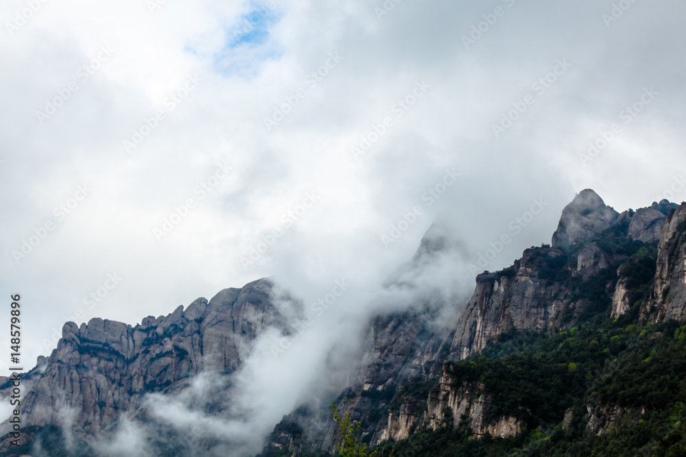 Clouds in the form of fog sliding down the mountain. Clouds in the form of fog sliding down the mountain.