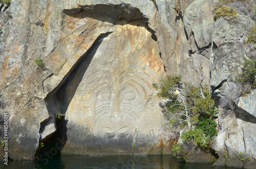 Maori Rock Carving at lake Taupo New Zealand photo