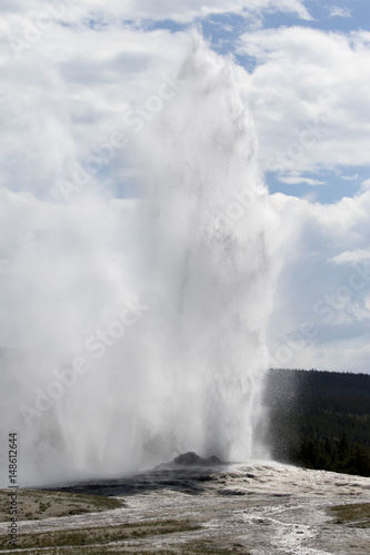 Old Faithful geyser erupting on regular schedule 