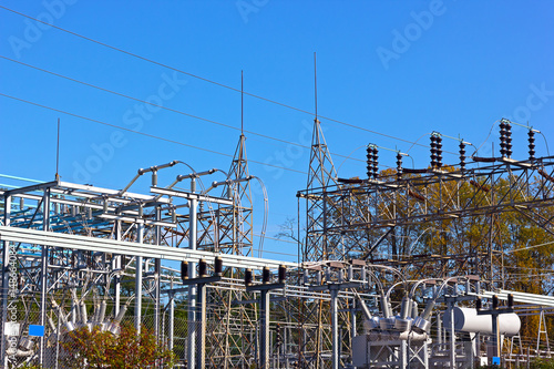 High-voltage equipment at power substation. Industrial urban landscape of power substation in autumn.