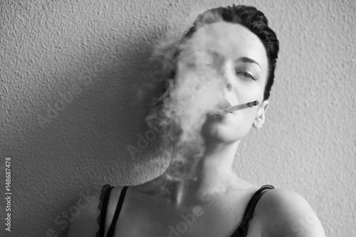 Sensual woman with a cigarette 