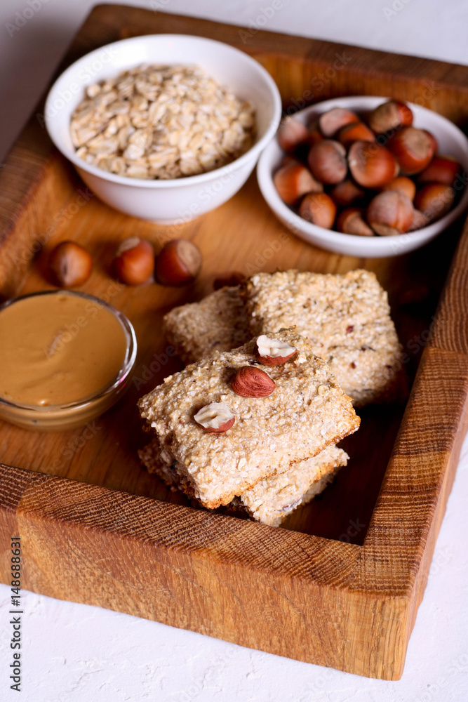 Fototapeta premium oat bars granola with hazelnuts and peanut butter, healthy snack