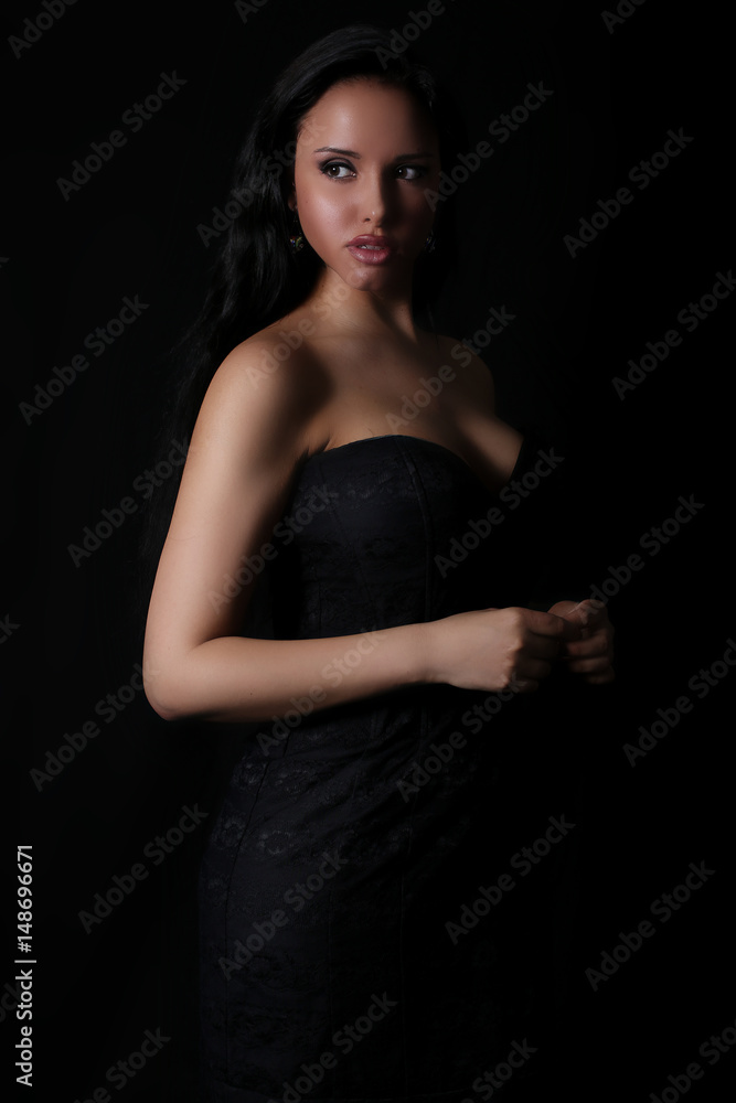 Beautiful woman wearing a black dress