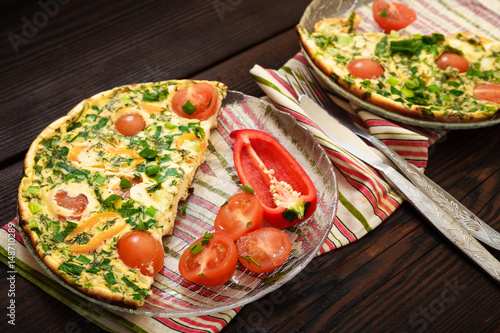 Omelette with herbs, tomatoes and sweet pepper 