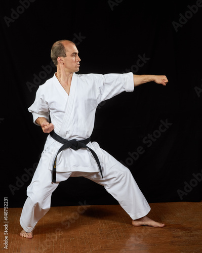 In the karate stand, the athlete performs a strike
