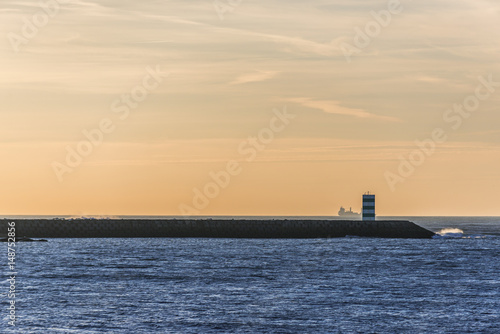 Vila Nova de Gaia small lighthouse seen from Porto river bank, Portugal