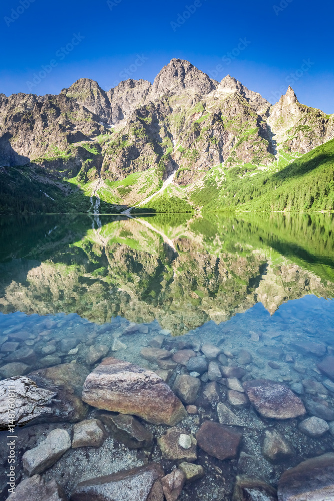 Stunning sunrise at lake in the Tatra Mountains, Poland, Europe